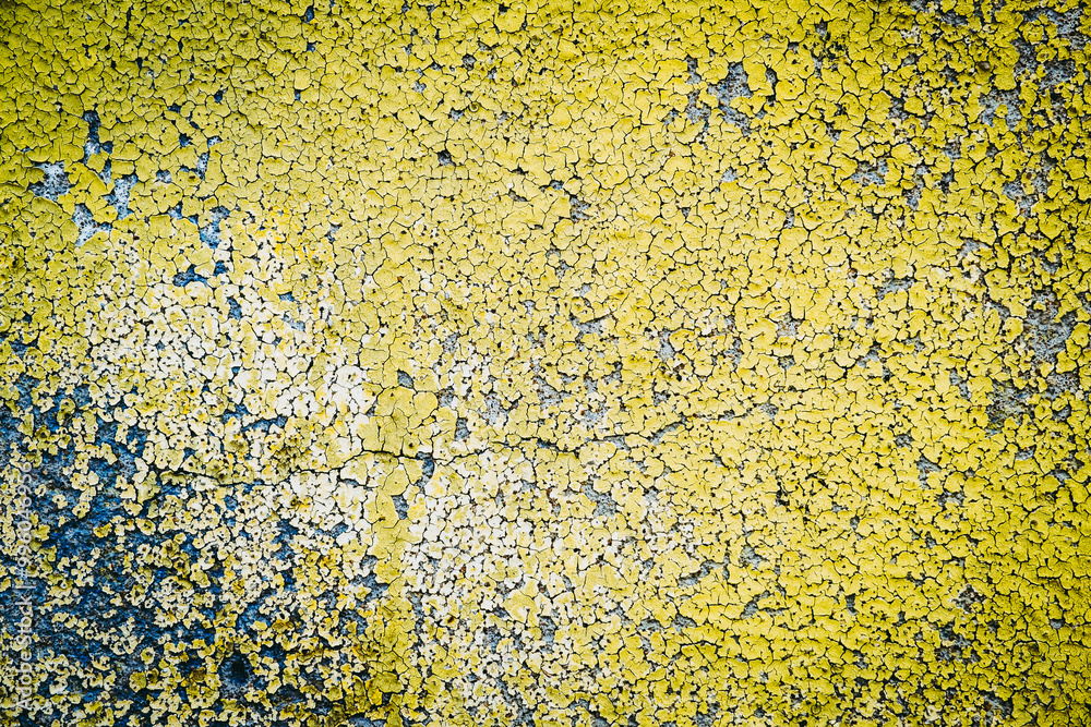 Mur ancien avec de la peinture jaune craquelée - Arrière plan texture grunge
