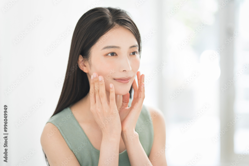 Skin care. Woman with beauty face touching healthy facial skin portrait. Asian woman.	
