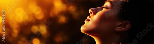 A serene profile of a woman enjoying a golden sunset, embodying peace and tranquility in nature.