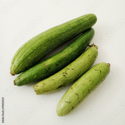 Sponge gourds isolated on a white background. Closeup on Luffa. loofa. photo