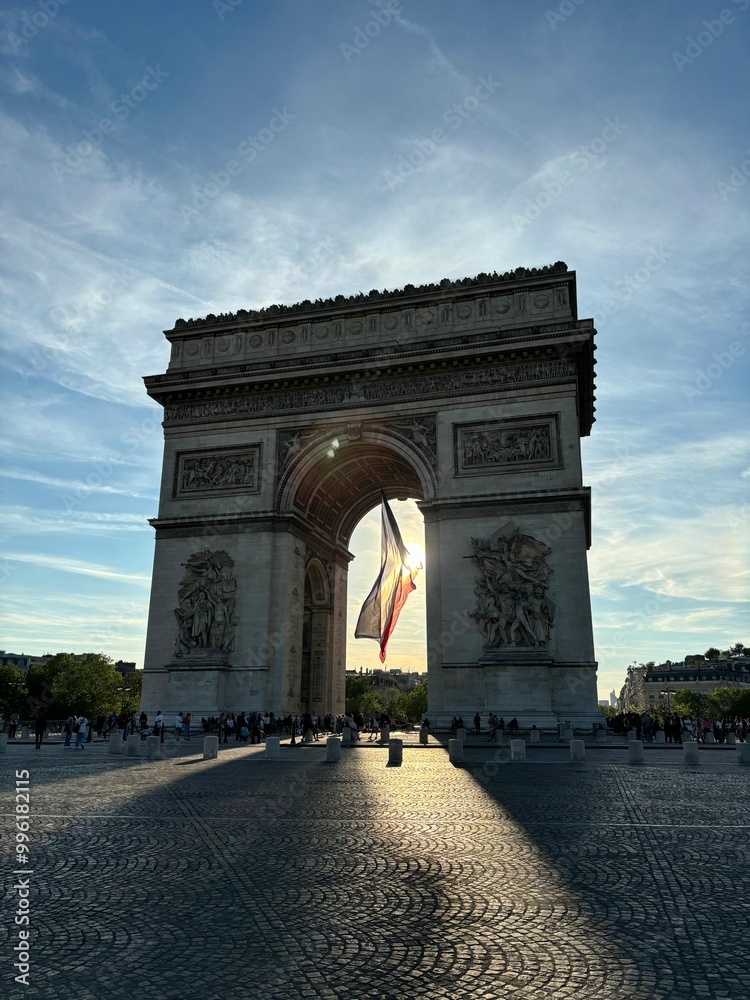 arc de triomphe, arch of triumph in paris france with french flag arc de triomphe, arch of triumph in paris france with french flag