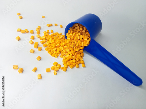 Red masterbatch granule, red polypropylene polymer granules, cold cutting type granule texture, isolated on white background, for industrial plastic company profile product catalog design photo