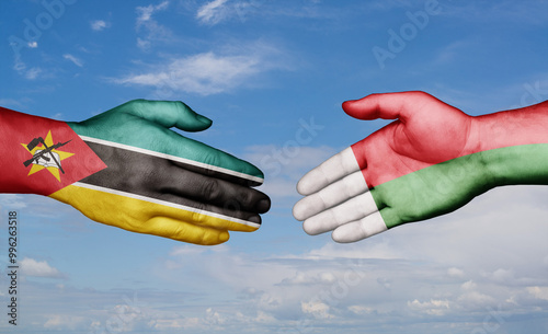 Madagascar and Mozambique country handshaking with flags, consensus concept international co-operation illustration