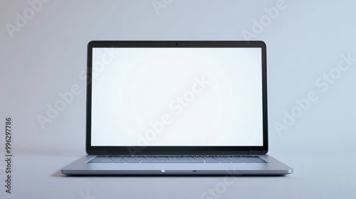 A sleek silver laptop with a blank white screen, set against a white background, ideal for tech product displays or digital marketing concepts.