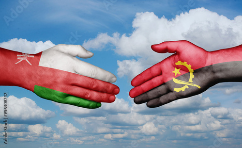 Oman and Angola country handshaking with flags, consensus concept international co-operation illustration