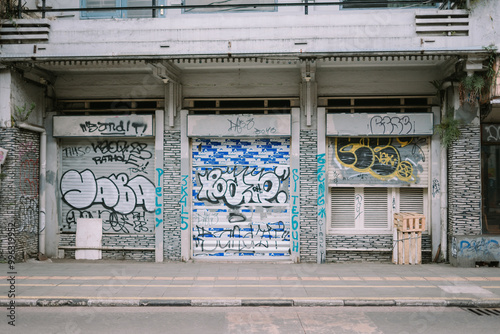 Bilde på lerret Vandalism artwork spray-painted on a residential house wall, displaying bold, un
