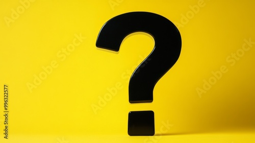 Large Black Question Mark Against a Bright Yellow Background