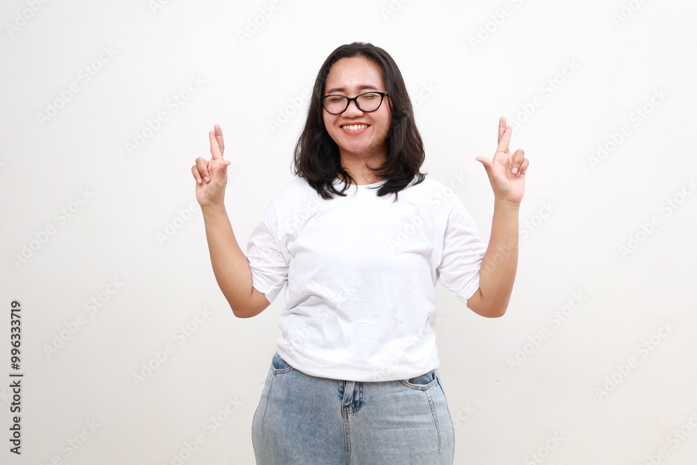 Happy girl feel nervous about her dream work cross fingers bite lips isolated over white background Happy girl feel nervous about her dream work cross fingers bite lips isolated over white background