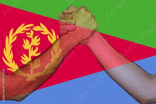 Two hands gathering front of Eritrea flag, togetherness and solidarity concept, union of society