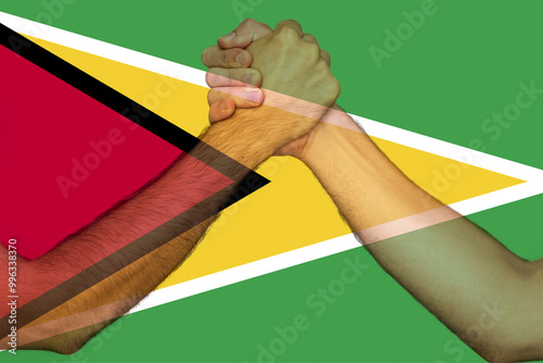 Two hands gathering front of Guyana flag, help or support for Guyana, union of society