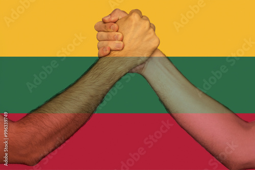 Two hands gathering front of Lithuania flag, help or support for Lithuania, togetherness and 