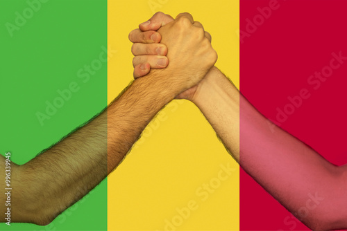 Two hands gathering front of Mali flag, human rights, union of society, togetherness and solidarity 