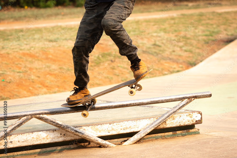 Skateboarder performing the nosegrind maneuver Skateboarder performing the nosegrind maneuver