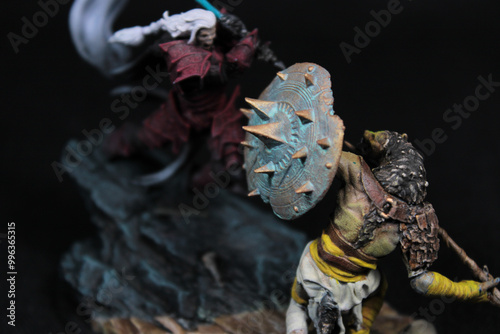 miniature battle scene with an undead warrior and hyena man
