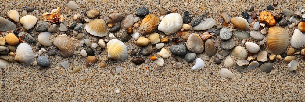 Coarse beach sand texture with small pebbles and shells mixed in Coarse beach sand texture with small pebbles and shells mixed in