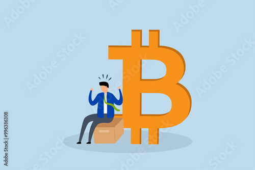 Fear, uncertain businessman investor is seated anxiously next to the Bitcoin symbol.