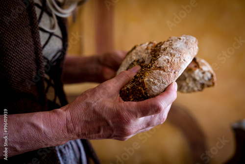 Hands breaking bread