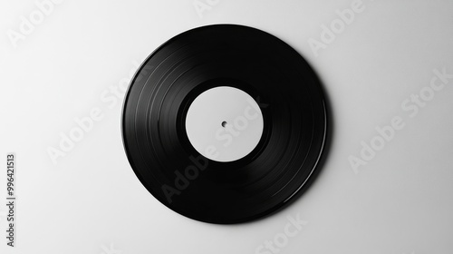 Mockup of a black vinyl record on a white background, a blank canvas for music design presentations.