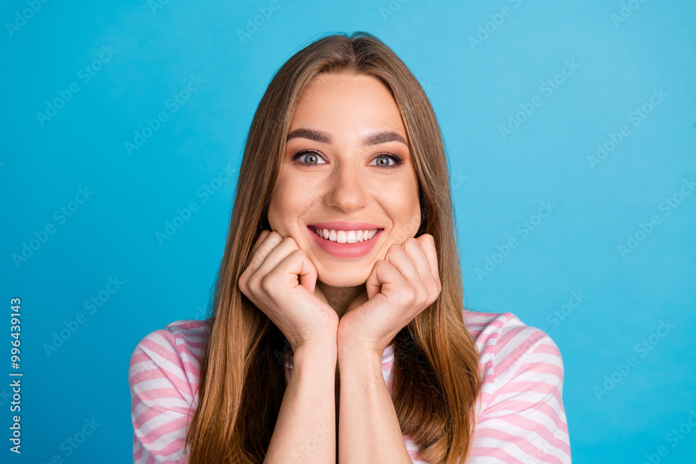 Photo of lovely cute woman wear stylish pink clothes isolated on blue color background Photo of lovely cute woman wear stylish pink clothes isolated on blue color background