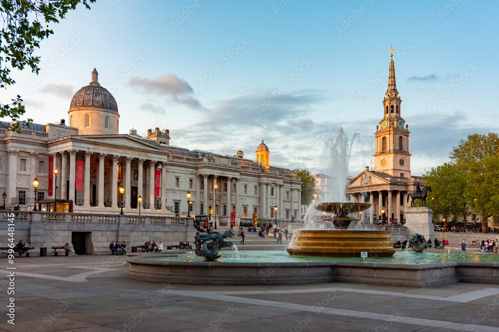 Fountain on Trafalgar square and National Gallery at sunset, London, UK