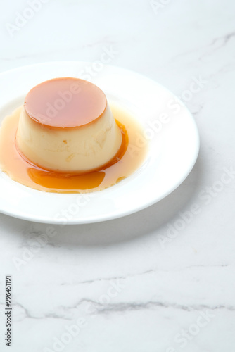 Caramel pudding plate on marble surface