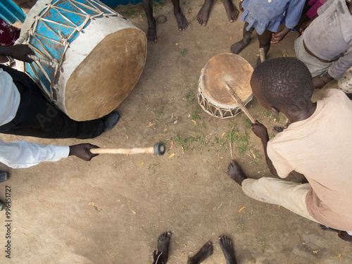 Overhead view of African people playing traditional drums in South Sudan. photo