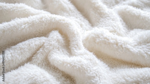 Fluffy white plush fabric texture filling the frame, evoking warmth and softness, perfect for a calming background.