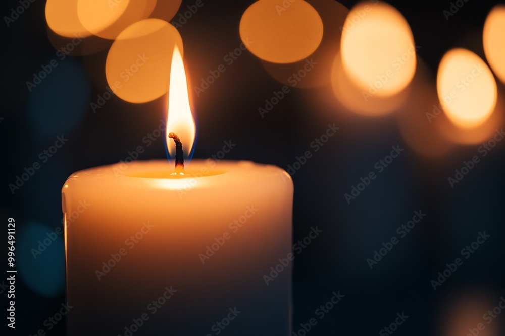 Close-up of a burning candle with a serene ambiance, perfect for relaxation, meditation, and creating a peaceful atmosphere. Close-up of a burning candle with a serene ambiance, perfect for relaxation, meditation, and creating a peaceful atmosphere.