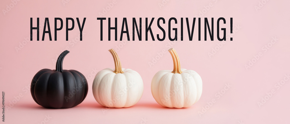 Happy Thanksgiving greeting card with text - Pumpkins, isolated on pastel pink background, minimalistic design Happy Thanksgiving greeting card with text - Pumpkins, isolated on pastel pink background, minimalistic design
