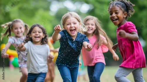 Happy Diverse Children Playing Together in a Park
