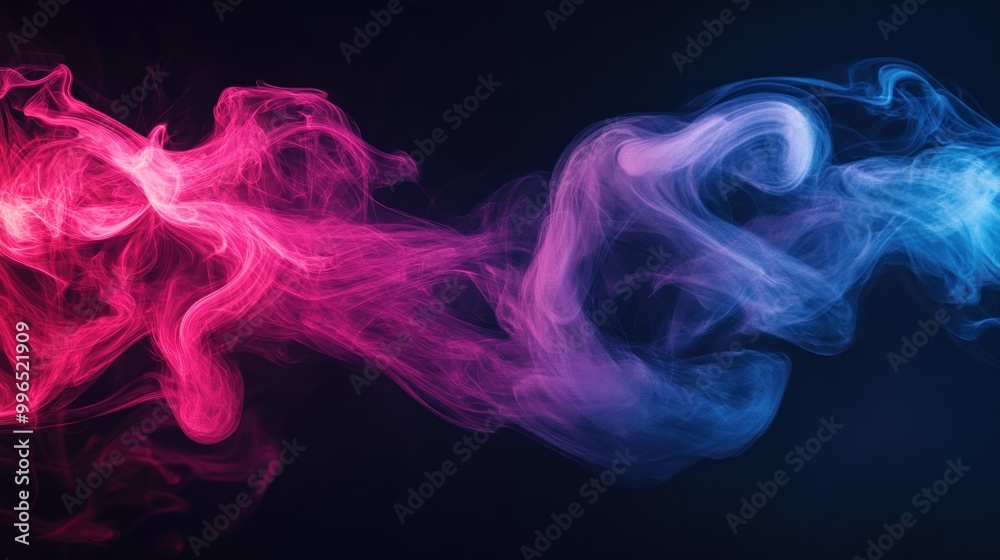 Colorful smoke swirls in shades of pink and blue, creating a mesmerizing abstract pattern against a dark background. Colorful smoke swirls in shades of pink and blue, creating a mesmerizing abstract pattern against a dark background.