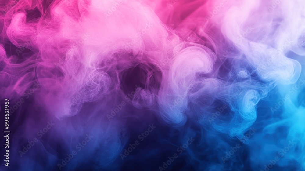 A vibrant swirl of pink and blue smoke creates a mesmerizing abstract background.