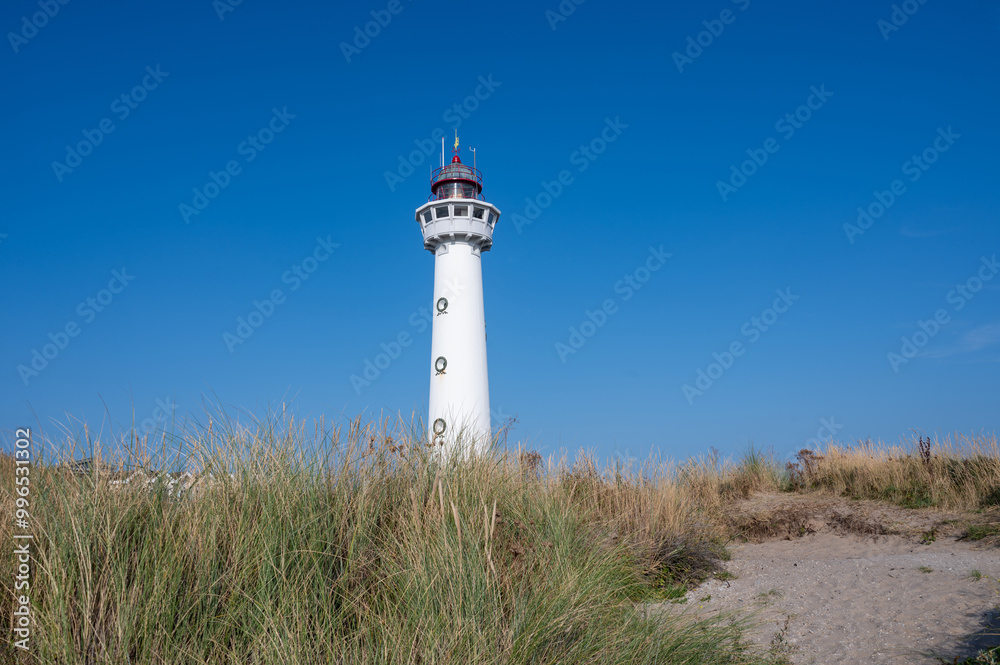 Lighthouse in the dunes of the Dutch town of Egmond aan Zee Lighthouse in the dunes of the Dutch town of Egmond aan Zee