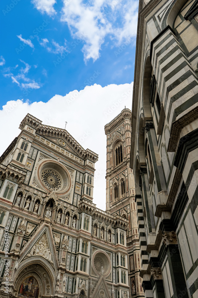 Fototapeta premium Florence Cathedral facade - Duomo di Firenze. Beautiful religious building with cloudy sky