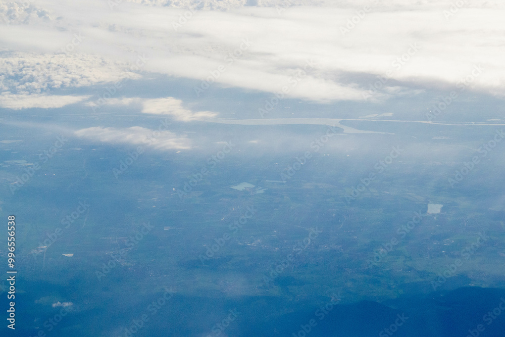 White passenger airplane flying in the sky amazing clouds in the background - Travel by air transport. High quality photo White passenger airplane flying in the sky amazing clouds in the background - Travel by air transport. High quality photo