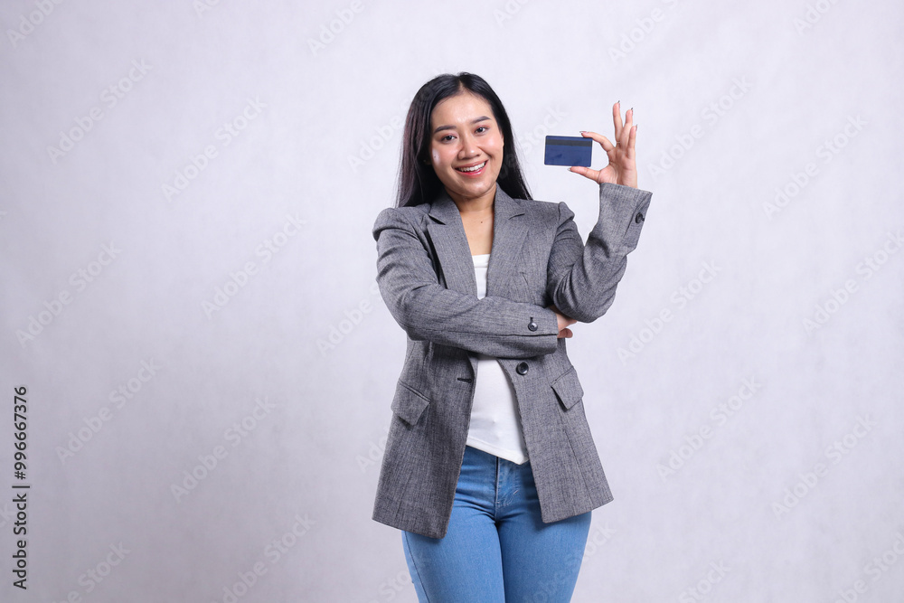 cheerful adult office woman beauty holding debit credit card wearing grey suit standing isolated on white background. for advertising content, lifestyle, finance, transaction cheerful adult office woman beauty holding debit credit card wearing grey suit standing isolated on white background. for advertising content, lifestyle, finance, transaction