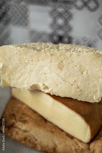 Traditional Caucasian homemade cheese sulguni . High quality photo. Georgian cheese, Imeretian and smoked suluguni, Georgian cuisine, no people, photo