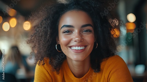 Portrait of a Smiling Young Woman with Curly Hair