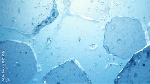 青い背景の上に敷き詰められた氷のテクスチャー素材　清涼感のあるクラッシュアイス　Ice texture material spread over a blue background. Refreshing crushed ice