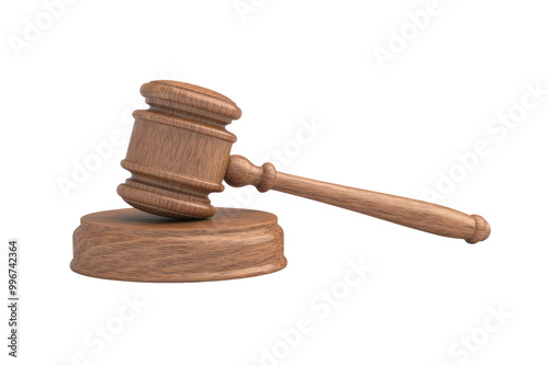 A wooden gavel rests on a wooden block against a black background.