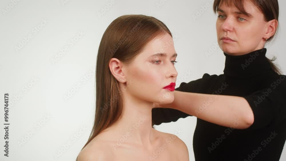 Beauty shot of woman makeup and hair artist doing hairstyle. Using hairspray for hair close-up.Concept of skincare, cosmetics, make up, beauty. Make-up and hair style tutorial Beauty shot of woman makeup and hair artist doing hairstyle. Using hairspray for hair close-up.Concept of skincare, cosmetics, make up, beauty. Make-up and hair style tutorial