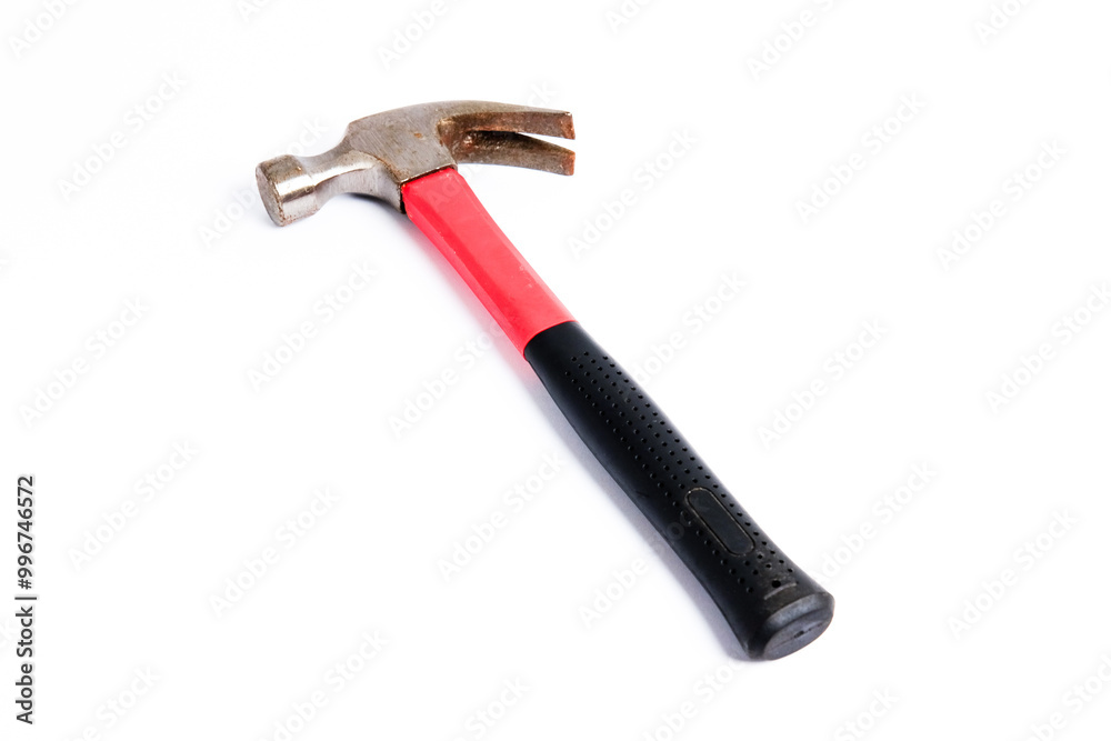 Close up medium sized hammer that has two functions as a nail pick and nail hammer, with a handle covered in black and red rubber isolated on a white background. Little bit rusty Close up medium sized hammer that has two functions as a nail pick and nail hammer, with a handle covered in black and red rubber isolated on a white background. Little bit rusty