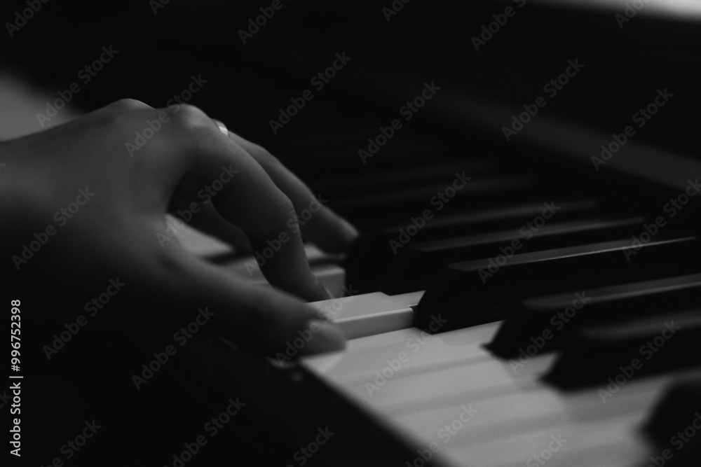 Obraz premium Close-Up Shots of Playing Piano Keys