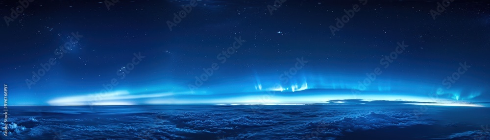 Fototapeta premium A blue sky with a few stars and a few clouds