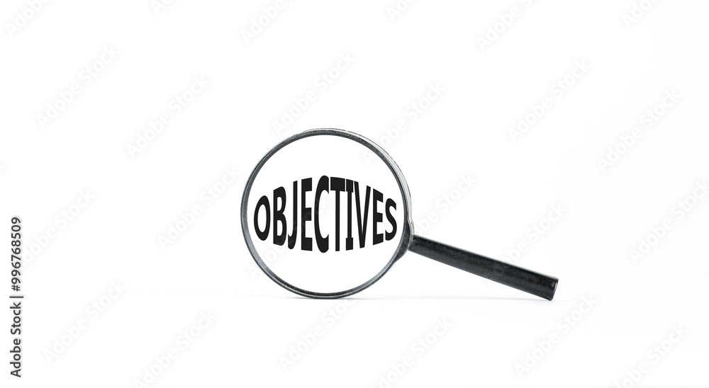 Objectives symbol. Concept word Objectives in beautiful magnifying glass. Beautiful white paper background. Business objectives concept. Copy space. Objectives symbol. Concept word Objectives in beautiful magnifying glass. Beautiful white paper background. Business objectives concept. Copy space.