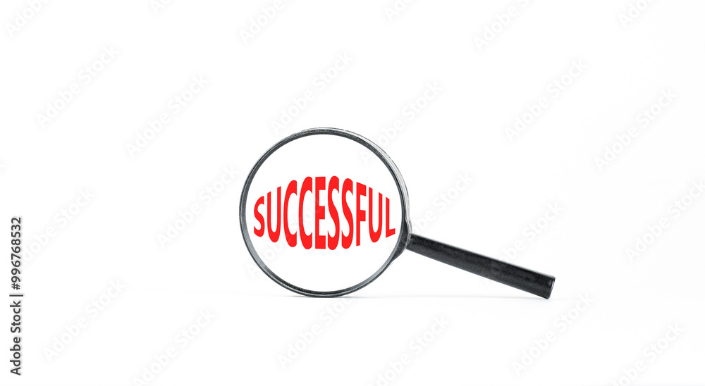 Successful symbol. Concept word Successful in beautiful magnifying glass. Beautiful white paper background. Business successful concept. Copy space. Successful symbol. Concept word Successful in beautiful magnifying glass. Beautiful white paper background. Business successful concept. Copy space.