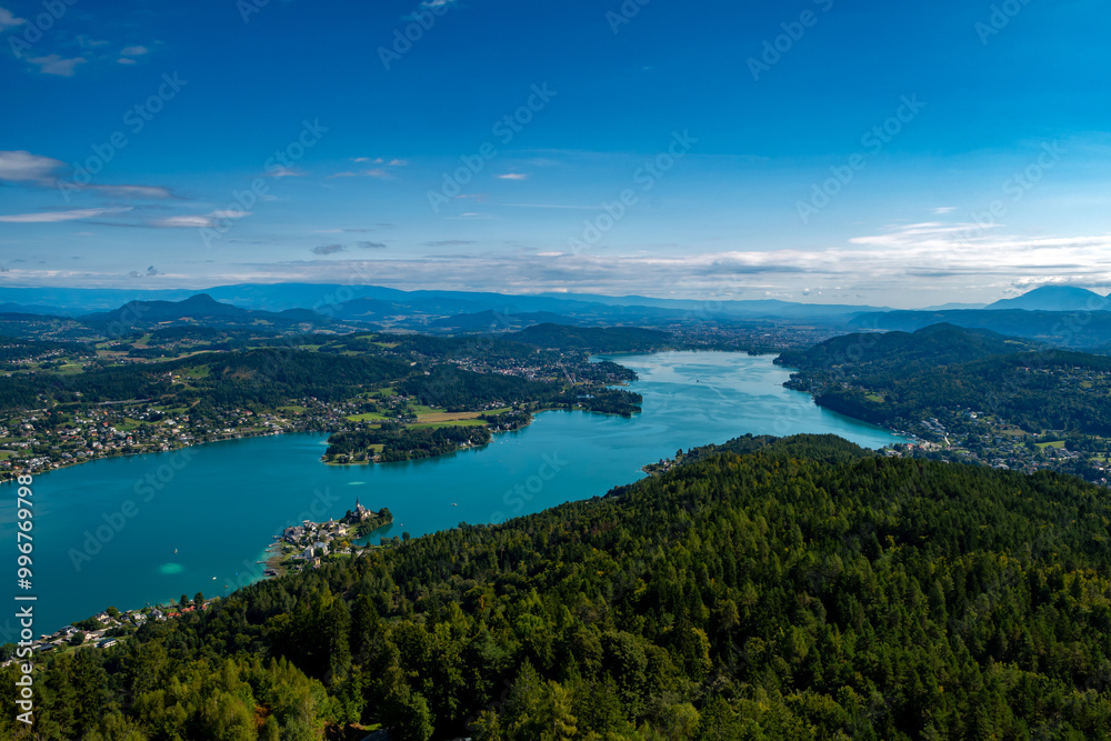 View Over Lake Woerthersee(Wörther See) And Village Maria Woerth On Peninsula In Carinthia In Austria View Over Lake Woerthersee(Wörther See) And Village Maria Woerth On Peninsula In Carinthia In Austria
