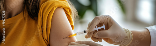 Close-up of a female arm being injected with a syringe for a medical procedure. 