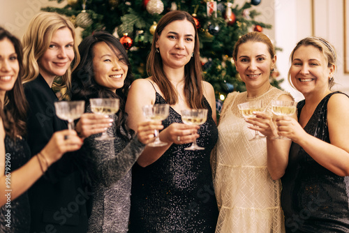 Close-up of female hands with elegant champagne glasses. photo