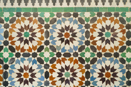 Mosaic arrangement of colorful tiles, blues, greens and browns on a white background